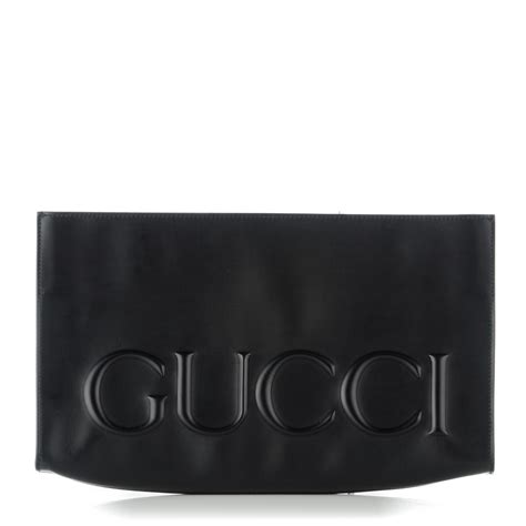 gucci embossed clutch bag